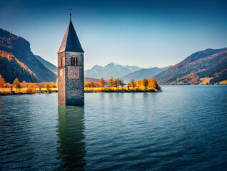 Wall Mural - attractive autumn view of tower of sunken church in resia lake. spectacular morning scene of italian