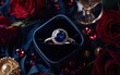 © Svitlana - A luxurious flat-lay featuring a sapphire ring, deep red roses, and a champagne-colored present for Valentines Day and 8 March