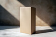 © Extra - A cardboard box is sitting on a white surface. Generative Ai.