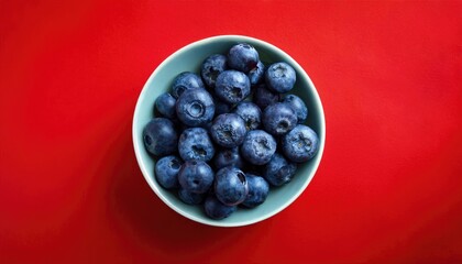 Wall Mural - Blueberries on a red background