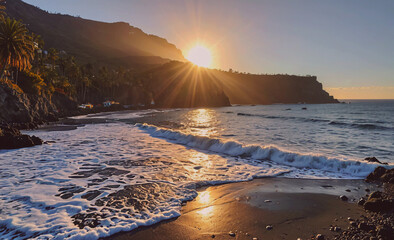 Poster - The sun is setting over the ocean, casting a warm glow on the water and the beach. The waves are crashing against the shore, creating a peaceful and serene atmosphere. The beach is empty