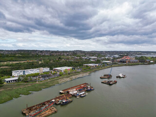 Wall Mural - High Angle View of River Thames at Rochester Town in the Unitary of Medway and Located at Kent, England United Kingdom. High Angle Drone's Camera Footage was Captured on April 20th, 2024