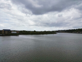 Wall Mural - High Angle View of River Thames at Rochester Town in the Unitary of Medway and Located at Kent, England United Kingdom. High Angle Drone's Camera Footage was Captured on April 20th, 2024