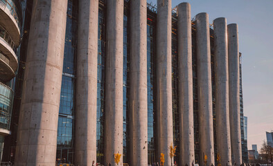 Poster - A tall building with many windows and a large tower. The building is made of concrete and has a modern design
