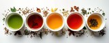 Assortment of six different types of tea in white ceramic cups. Colorful brewed teas with tea leaves. Variety of tastes, flavors. Healthy beverages displayed on white background. Collection of