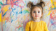 © Nemanja - Playful Child Scribbling Colorful Graffiti on White Wall at Home