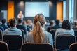 © Margarita - Audience at Business Conference Listening to Speaker in Modern Hall