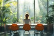 © btiger - Cheerful businesswoman enjoying a meeting in a modern office space