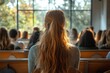 © Anastasiya - Female Speaker Presenting in University Lecture Hall with Attentive Participants Taking Notes at Science Workshop Event