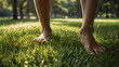 © SMURFFYx - Barefoot on Grass: A close-up of bare feet walking on lush green grass, capturing the simple pleasure of grounding oneself in nature. The sun's warm glow bathes the scene.