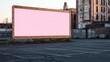 © Abdul - Empty billboard with a bold pink frame in front of a simple parking area.