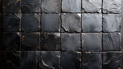 Sticker - A close-up view of a textured slate surface with dark, natural stone tiles arranged in a grid pattern