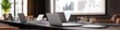 © Aryan - A business presentation with projected data laptops and high-end office furniture creating a professional and sophisticated setting