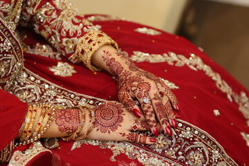 Bridal mehndi- henna tattoo on women hands. mehndi is a traditional indian decorative art. ( mehndi hands), Indian and pakistani wedding tradition.	