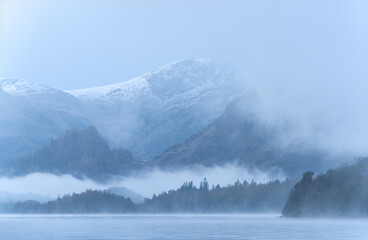 Wall Mural - Absolutely stunning dramatic atmospheric landscape image of Derwentwater during foggy sunrise in Autumn