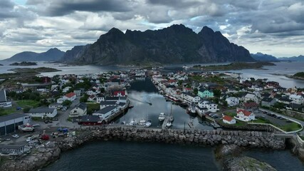 Wall Mural - Drone footage of Henningsvaer village in Lofoten Islands Norway with seascape and rocky shores