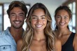 © boler - Three smiling young adults pose together for a photo
