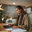 © Miljan Živković - adult woman coiffure work on laptop and clipboard at home