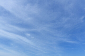 Wall Mural - Blue sky background with tiny clouds. Cloudscape - Blue sky and white clouds. Clouds with blue sky