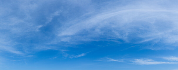 Wall Mural - Blue sky background with tiny clouds. Cloudscape - Blue sky and white clouds. Clouds with blue sky