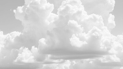 Wall Mural - Fluffy white clouds stretch across a seamless sky background. Background texture of fluffy white clouds. 
