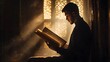 © Berkah - Young Man Reading Sacred Text in Golden Light
