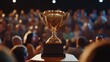 © Johannes - A golden trophy symbolizes success as a team member is honored with applause, embodying the spirit of employee appreciation and achievement.
