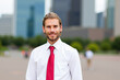 © Minerva Studio - Portrait of businessman smiling in La Défense, Paris