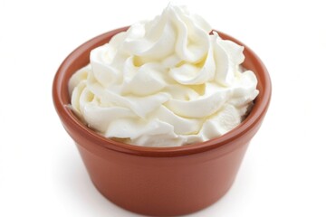 Canvas Print - A bowl filled with fluffy whipped cream on a clean white surface, perfect for desserts or decoration