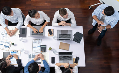 Fototapete - Top view analyst team utilizing BI Fintech to analyze financial data at table in meeting room. Analytic BI dashboard power on paper for business insight and strategic marketing planning. Prudent