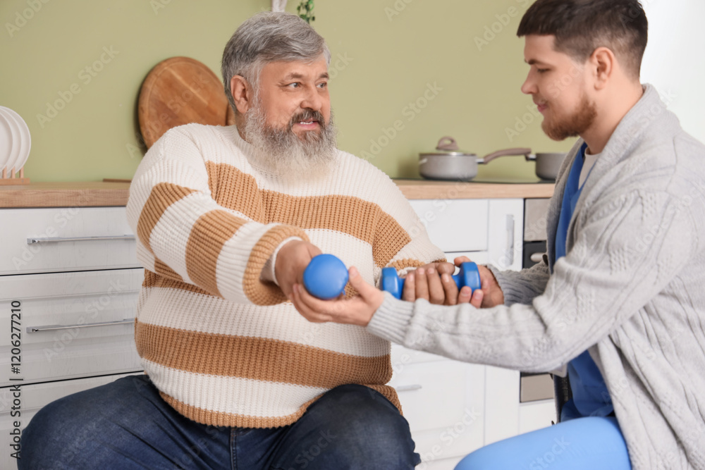 Senior man with dumbbells and caregiver training at home