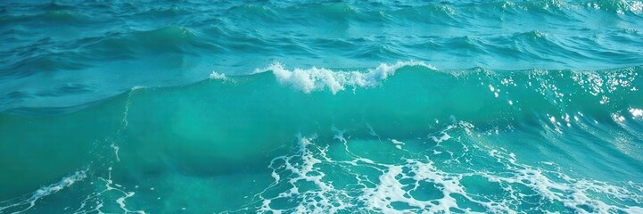 Wall Mural - shimmering blue-green sea, gentle wavelets with frothy edges, tranquil, summer