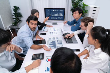 Fototapete - Analyst team utilizing BI Fintech to analyze financial data at table in meeting room. Businesspeople analyzing BI dashboard power for business insight and strategic marketing planning. Prudent