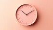 © Penatic Studio - A pale pink analog clock on a wall