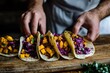 © Anjali - Delicious tacos filled with roasted sweet potatoes, shredded red cabbage, and cilantro.