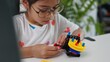 © FAMILY STOCK - STEM education concept. Asian home school girls self-study online lessons and are excited to make STEM toys. mathematics engineering science technology computer code in robotics for kids' concepts.