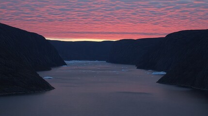 Wall Mural - pink sunset over a fjord with icebergs.