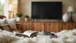 © Nikole24 - Cozy living room with books and TV