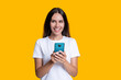 © be free - Woman blogger use smartphone isolated on yellow. Surfing internet and blogging. Chatting and texting SMS. Millennial woman chat online. Woman blogging on phone. Communication chat. Buy online