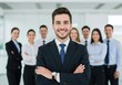© Pixelpulse Creative  - A confident businessman standing in the foreground with his arms crossed, smiling, while a diverse group of professionals stands behind him