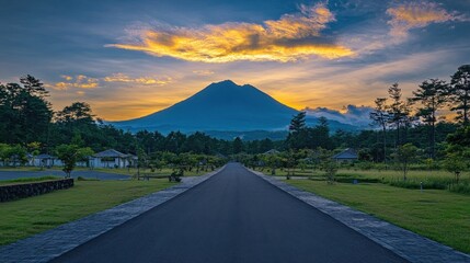 Wall Mural - Scenic road leads to majestic volcano at sunset, houses and trees line the path. Ideal for travel, nature, and serenity themed projects, evokes calmness and adventure.