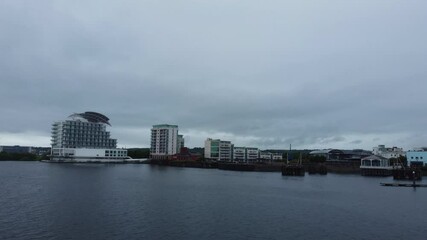 Wall Mural - Ocean Bay and British Tourist Attraction at Central Capital City of Cardiff, Wales, UK. Aerial Footage Was Captured During Rainy and Windy Day with Drone's Camera on May 28th, 2024