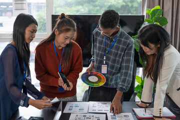 Wall Mural - group of software engineers design ux/ui for applications on smartphone/laptop