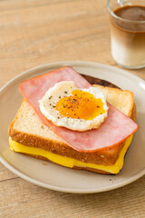 Sticker - bread toasted cheese topped ham and fried egg with pork sausage