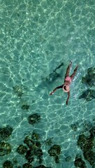 Poster - Experience the beauty of Koh Kradan Thailand as someone swims in its tranquil turquoise waters.