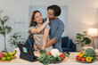 © crizzystudio - Young asian couple having fun preparing a healthy meal with fresh vegetables in their modern kitchen, following a recipe on a digital tablet