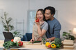 © crizzystudio - Young chefs preparing healthy meal with fresh vegetables in modern kitchen, following recipe on tablet, promoting healthy lifestyle and culinary skills