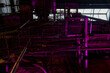 © K - Artistic purple colored pipes of old factory building for events and creative venue lighting setting