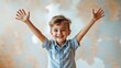 © Robbie Smith 1  - A young boy is smiling and holding his arms up in the air