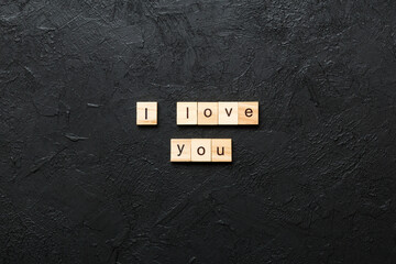 i love you word written on wood block. i love you text on table, concept